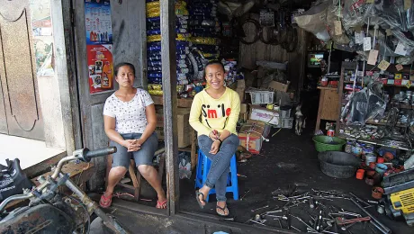 Elfrieda Turnip and her daughter Joanna used the CUM loan to boost their motorcycle repair business. Photo: LWF/C. KÃ¤stner