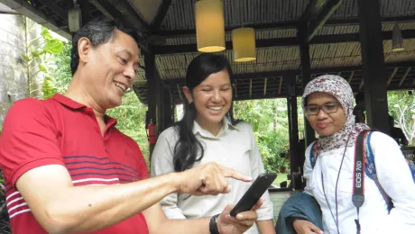 Learning the social media ropes: meeting participants Leonard Epafras from ICRS, Febrisa Silaban from member church HKBP and Elis Setyawan share ideas on promoting inter-religious work. Photo:LWF/S. Sinn