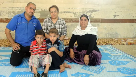 Amer Abdullah, left, fled the town of Baashiqah with his family. They are taking shelter in a school in Northern Iraq. Photo: Anne Dreyer/ACT-DKH