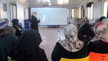 Wafeh shares her knowledge in the womenâs group. Photo: LWF/N. Boase