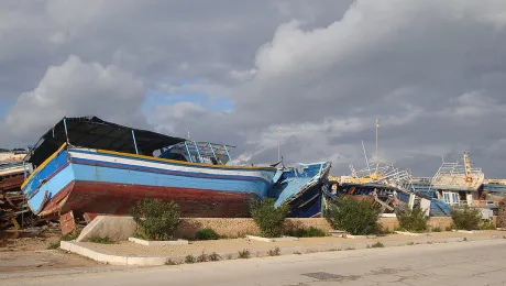 Vessels used to transport migrants across the Mediterranean Sea lie rotting and decayed in a shipsâ graveyard on the Italian island of Lampedusa. Photo: CCME/Franca di Lecce