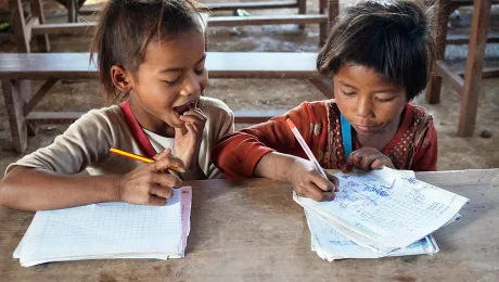 Caption: Vone and Viengkeo are eager students at the local school. Photo: LWF Laos