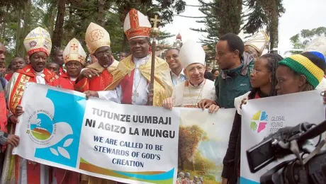 Bishop Younan (fourth from right) stands among Lutheran leaders welcoming a group of young Lutherans who climbed Mt Kilimanjaro. He told worshippers at the close of the Marangu conference that the challenge for Lutherans was to empower African Christians to more fully contextualize the gospel. Photo: LWF/Tsion Alemayehu