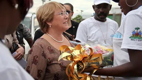 Michelle Bachelet receives flowers during a visit to Haiti in 2012 during her tenure as UN Women executive director. Photo: UN Women (CC-BY-NC-SA)