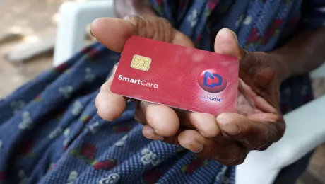 Ndapanda Mentte Shandingi shows a Nampost debit card. Photo: LWF/M. Hyden