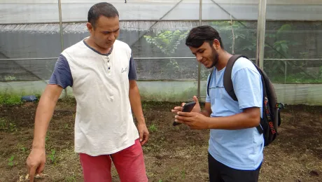 Anil, LWF Trainee, demonstrates features of the GeoKrishi app to local farmer in Nepal. Photo: LWF Nepal