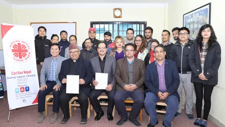 LWF representatives and Caritas Nepal team after signing the MoU in the Caritas Nepal office. Photo: LWF