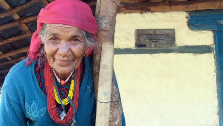 Kali Kamini, known as âgrandmaâ to the village, in front of her new house. Photo: LWF/ U. Pokharel