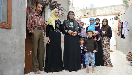  A Syrian family living in an unfinished building in Al Mafraq. Many refugees have to trade their food vouchers to pay the rent. Photo: LWF/ M. Renaux