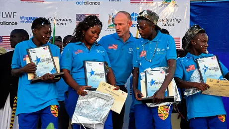 Jesse Kamstra, LWF country representative in Uganda (center), with the winners of the contest. Photos: LWF/ S. Nalubega