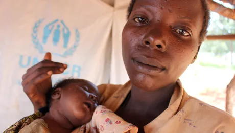 Hatungaimana Justina gave brith to baby Furaha Eliza just days after fleeing her native Burundi. She and her family made it to the safey of the Mtendeli camp where LWF partner, Tanganyika Christian Refugee Service drills boreholes that supply water to the camp. Photo: LWF/S.Cox