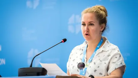 Ms Vera Tkach, chairperson of the Ad-hoc Committee for Advocacy and Public Voice, presents the resolution on Nigeria to the LWF council. Photo: LWF/ Albin Hillert