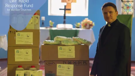 The Lutheran Church in Grodno, Belarus, Rev. Vladimir Tatarnikov stands with supplies purchased with LWF COVID-19 Rapid Response Funds. Photo: The Lutheran Church in Grodno