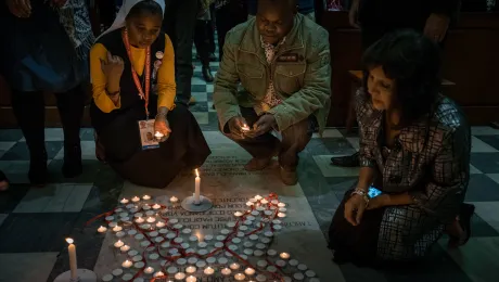 Participants light candles during a July 19 interfaith prayer service, held at the Roman Catholic Emmanuel Cathedral in Durban, South Africa, during the 2016 International AIDS Conference