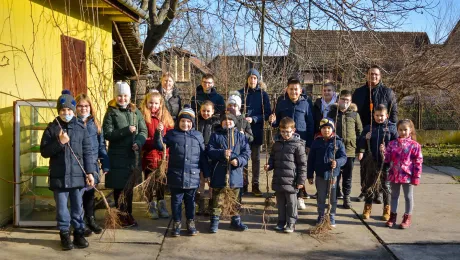 Pastor Miroslav PonjiÄan (back right) with youth and children, preparing for a tree planting activity in the Slovak Evangelical Church of the Augsburg Confession in Serbia (SEAVC). Photos: SEAVC