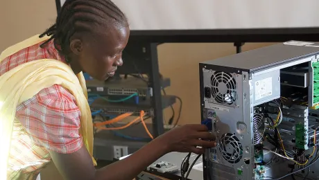 Primary school teacher Afrina Zechariah Anabak inspects the connection ports on her computer. Photo: LWF/C. KÃ¤stner