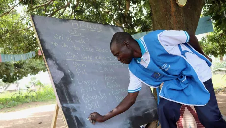 Paul Sunday Odriga teaches students at at Duba Functional Adult Learning Centre in Adjumani district. Photos: LCCN