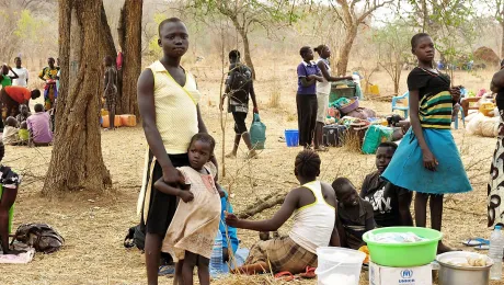 Refugees wait for land allocation in Palorinya refugee settlement, after walking for days. Photo: LWF/ C. KÃ¤stner