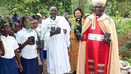 Planting trees has become part of church life in ELCT: (from the right) Bishop Fredrik Shoo, Rev. Faustine Kahwa, Rev. Solomon Massawe and students attending confirmation classes preparing for a tree planting in Tanzania's Northern Diocese. Photo: ELCT