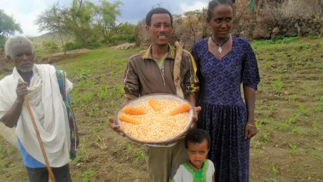 Amare Mulaw and his family, showing his âLutheranâ corn. Photo: LWF/ Yitbarek FREW