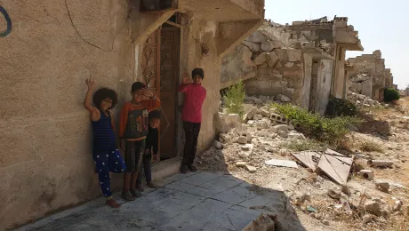 Children play in the destroyed suburbs in Aleppo. Photo: LWF/ R. Schlott