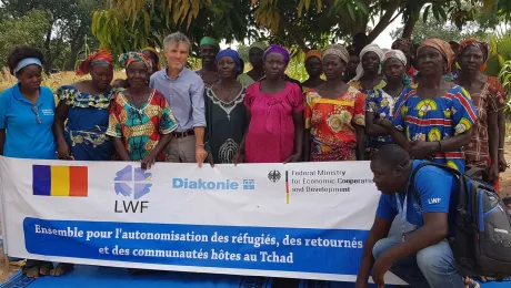 LWFâs Josef Pfattner stands with a group working on strengthening resilience and self-sufficiency for women in Chad. Photo: LWF/Chad