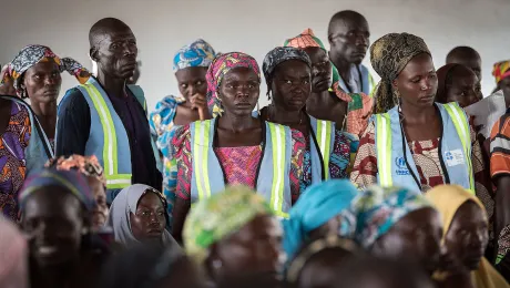 Refugees wait their turn, at a distribution of non-food items in Minawao. The Minawao camp for Nigerian refugees, located in the Far North region of Cameroon, hosts some 58,000 refugees from North East Nigeria. The refugees are supported by the Lutheran World Federation, together with a range of partners. Photo: LWF/Albin Hillert