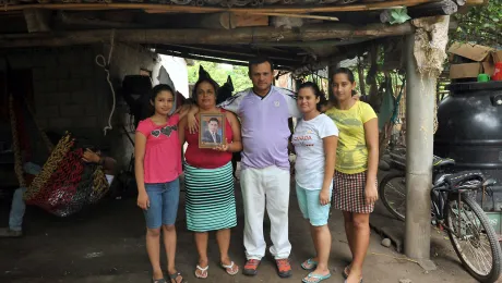 Rigoberto and his family with an image of their son, who was kidnapped on the migration route to the US. Photo: LWF/C. KÃ¤stner