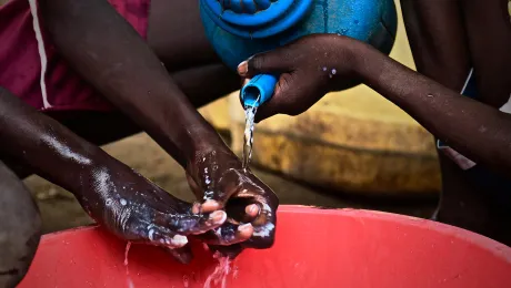 Children demonstrate hand washing at Kakuma refugee camp; Kenya. LWF has reinforced hygiene education to prevent a spread of COVID-19 in the camp. Photo: LWF/ P. Omagwa