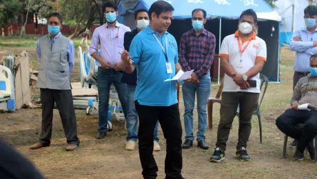 Mr. Yagya briefs the local community about the LWF COVID-19 response during a handover of medical equipment at the hospital in Morang, Nepal. Photo: LWF Nepal