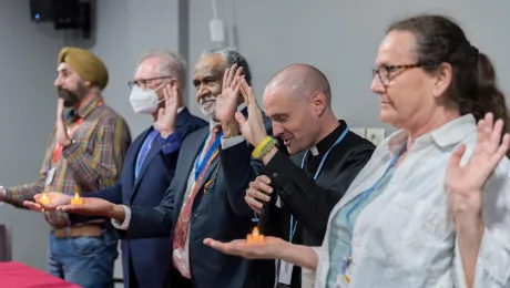 A moment of blessing by Chad Rimmer (second from right), LWF’s Program Executive for Identity, Communion and Formation, to conclude the prayer during the Talanoa interfaith gathering on the eve of COP27 in Egypt. Photo: LWF/Albin Hillert 