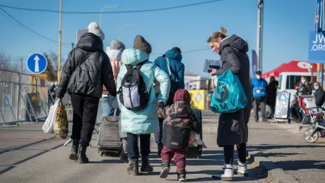 Women and children flee across the border between Slovakia and Ukraine following the Russian invasion in February 2022. Photo: LWF/A. Hillert