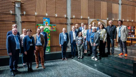 Participants and LWF leadership gather around the Lund cross in the Ecumenical Center chapel. Photo: LWF/ S. Gallay