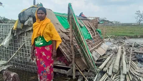 Daw Raw Bi Tu in front of her destroyed home near Sittwe, Myanmar. Photo: LWF Myanmar