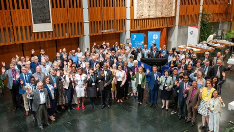 LWF Council in the lobby of the Ecumenical Center, with advisers, guests and LWF staff, in Geneva in 2022. Photo: LWF/S. Gallay