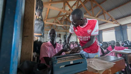 Teacher James Lobalu, from South Sudan, shows Wuor Gai, who is blind, a drumming rhythm. All photos: LWF/Albin Hillert