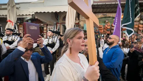 A woman leads the procession into the Lutheran Church of the Redeemer, Jerusalem, for the ordination service for Sally Azar of the Evangelical Lutheran Church in Jordan and the Holy Land, on 22 January 2023. The LWF voiced deep concern about the siituations of Christians in the Holy Land. Photo: LWF/Albin Hillert