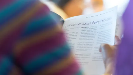 A participant reads the Gender Justice Policy during the recent women’s pre-Assembly in Wroclaw, Poland. Photo: LWF/A. Hillert