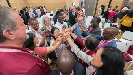 The message of God’s love calls us to go out into the world and to serve all people." In the photo, LWF member church delegates take part in a joint exercise, prior to the start of the Thirteenth Assembly in Kraków, Poland, last September. Photo: LWF/Albin Hillert 