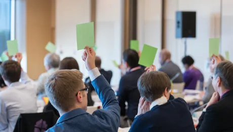       Council Members raise green cards to vote in favor of a motion as the newly LWF Council convenes for their first session following the Lutheran World Federation (LWF) Thirteenth Assembly, held in Krakow, Poland on 13-19 September 2023 under the theme of ’One Body, One Spirit, One Hope’. Photo: LWF/Albin Hillert