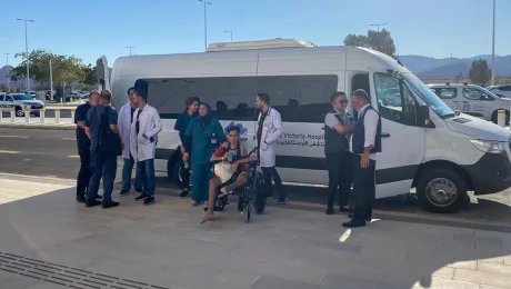 AVH staff wait outside the Kerem Shalom checkpoint for patients to leave Gaza. Photo: AVH/LWF Jerusalem