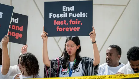 Participants in the COP28 climate summit in Dubai, United Arab Emirates last December, highlight the urgency of ending the use of fossil fuels. Photo: LWF/A. Hillert