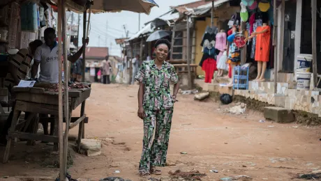 Lidya Nkiruka Udekwe – a participant in LWF project Symbols of Hope – pictured outside her shop in the Lugbe suburb on the outskirts of Abuja, where she makes a living selling clothes. Through this business, she can now provide for her four children. Photo: LWF/Albin Hillert