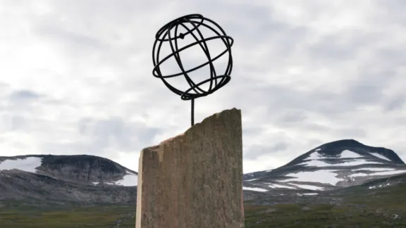 A monument marks the Arctic Circle in Saltfjellet, Norway. Snow previously covered these mountaintops all year round. Photo: Ryan Rodrick Beiler