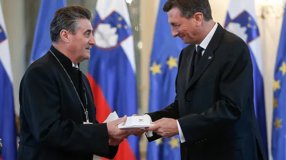 Republic of Slovenia President Borut Pahor awards Bishop ErniÅ¡a the Silver Order of Merit. Photo: Stanko Gruden/STA