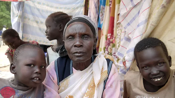 Tabisa Nyabol and her grandchildren in Adjumani, Uganda. Photo: ACT-DCA-LWF/Mai Gad