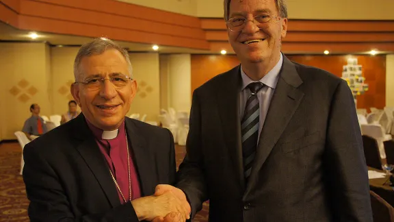 LWF President Bishop Dr. Mounib Younan thanks outgoing DWS Director Eberhard Hitzler for his dedicated service. Photo: LWF/S. Lawrence