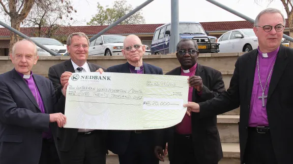 LWF Delegation presenting donation to drought relief. Â© The Namibian