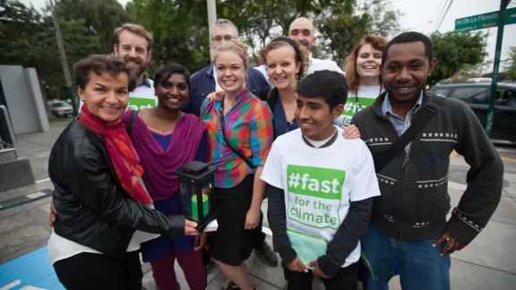 LWF Youth Delegation to COP20 pose with UN Climate Change Secretariat, Christiana Figueres in Lima, Peru         Photo: LWF/Sean Hawkey 