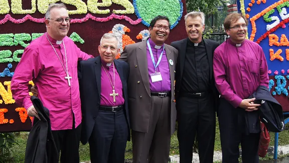 Part of the communion: Bishop Langsung M Sitorus (center) with Bishop Dr Frank O. July, LWF President Bishop Dr Munib A. Younan, LWF General Secretary Rev. Martin Junge and Bishop Dr TamÃ¡s Fabiny. Photo: LWF/ C. KÃ¤stner